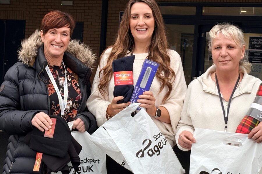 Partners carrying homeless support items