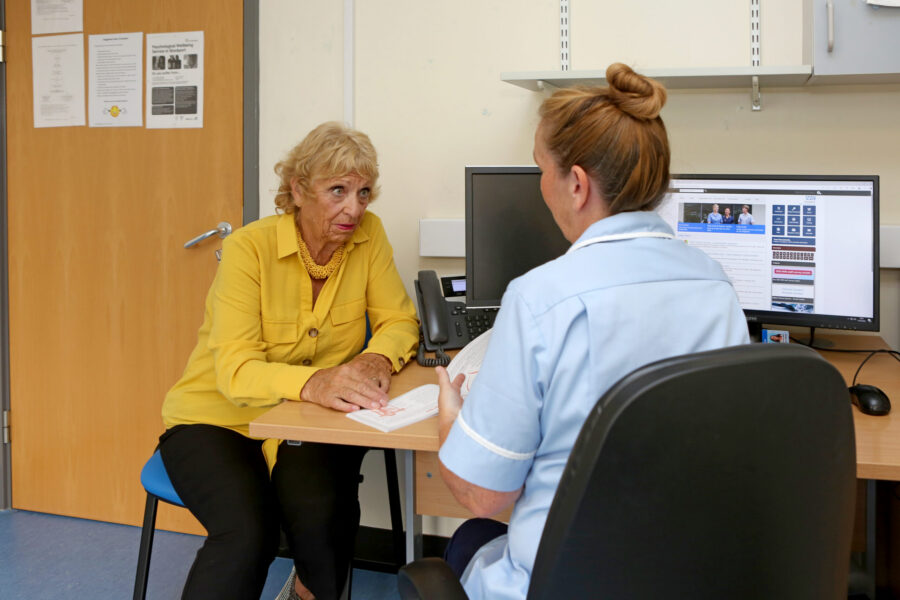 Patient and nursing staff member during appointment
