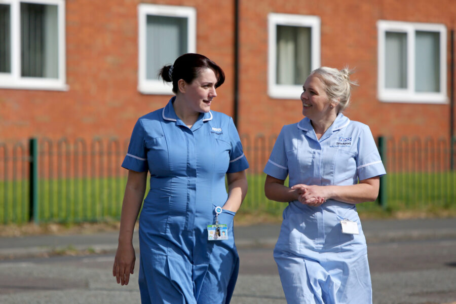 Two nursing staff talking