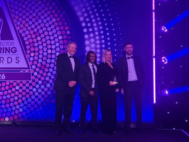 Catering award team members receiving their PSC award on stage