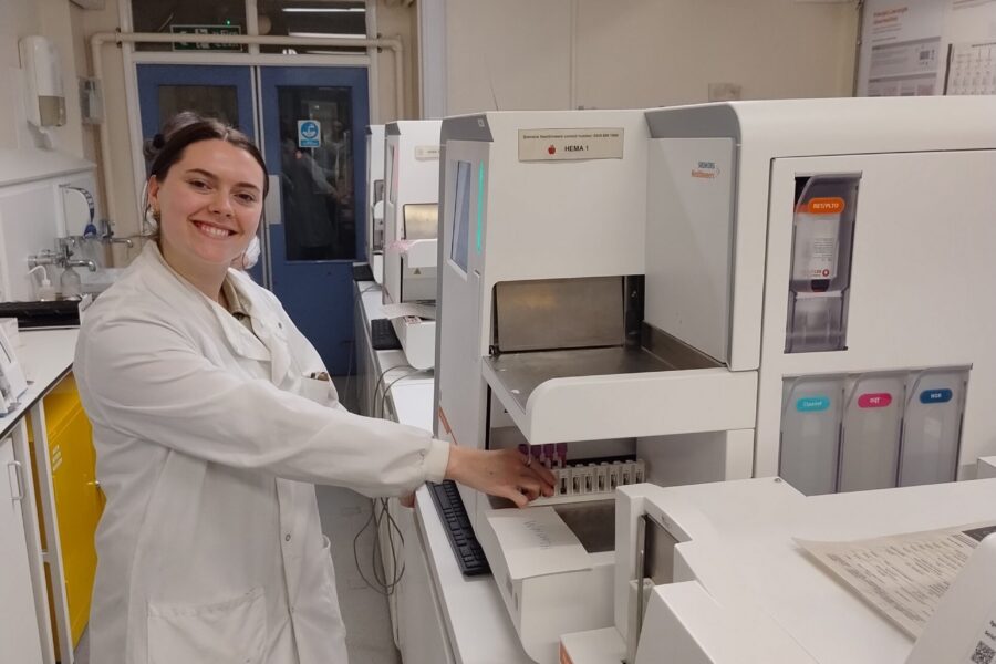 Female path lab staff members taking part in blood science tests