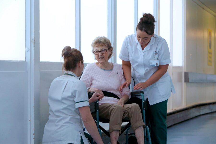 Physios caring for patient