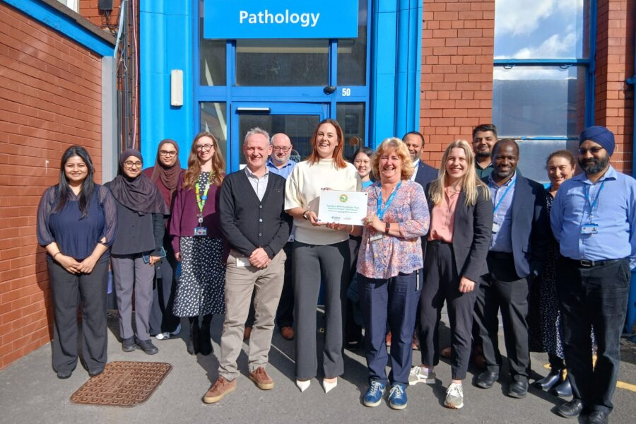 Pathology team with My Green Lab certificate