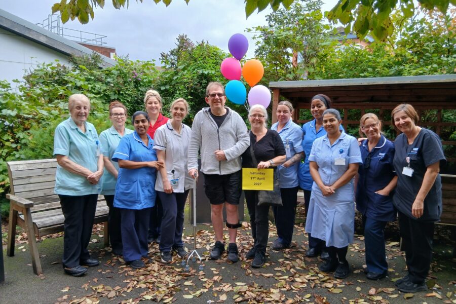 Andy Shaw and wife Bernadette with stroke unit staff supporters in the unit's therapy garden