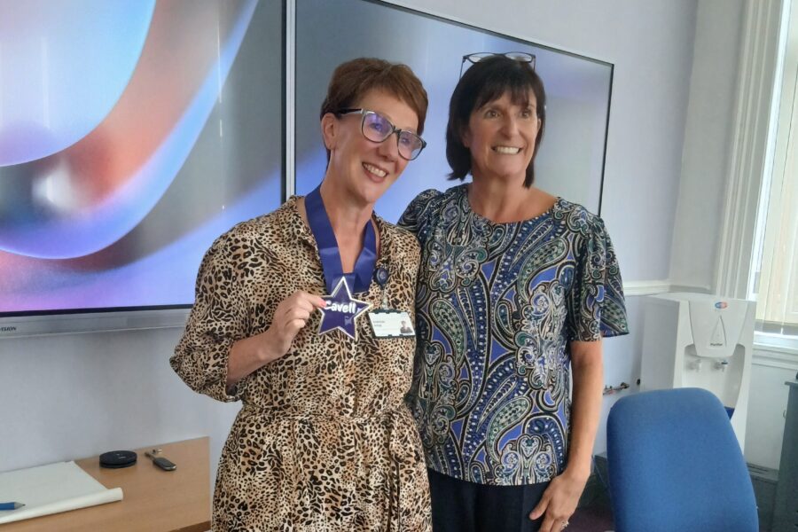 Sharon Hyde (left) receiving Cavell Star award with Deputy Chief Nurse Helen Howard